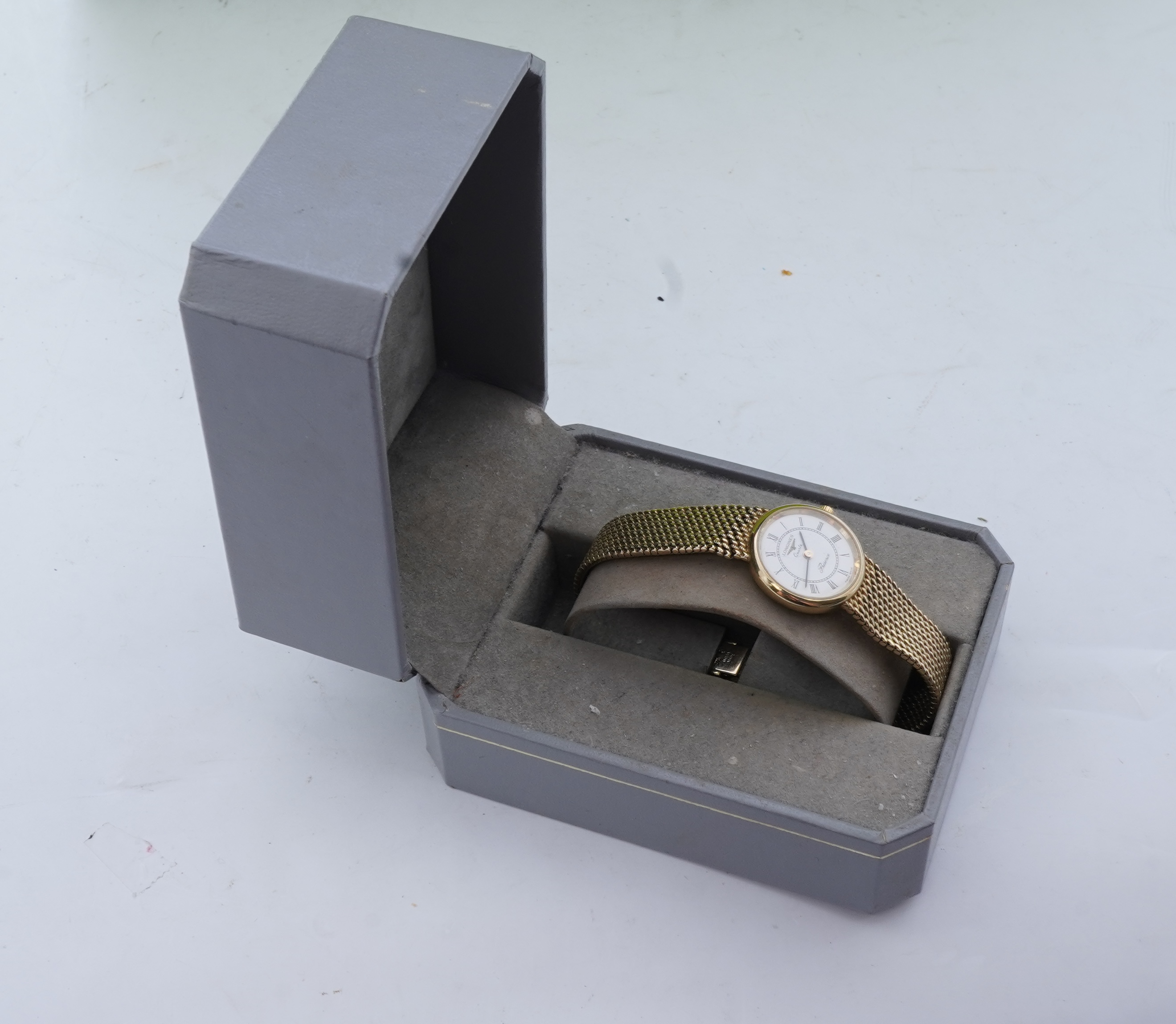 Longines, a gold watch